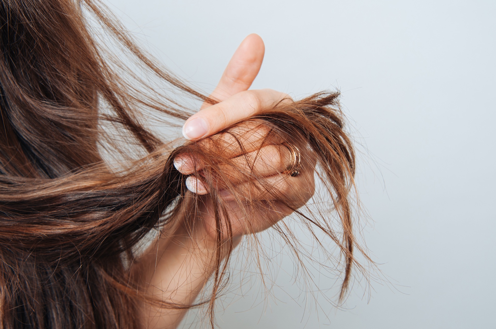 Brittle damaged hair caused by hard water