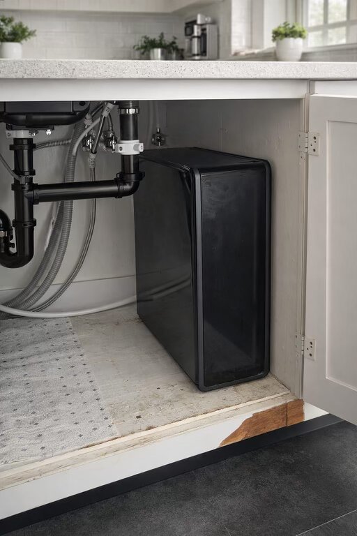 Compact tankless reverse osmosis unit installed under kitchen sink