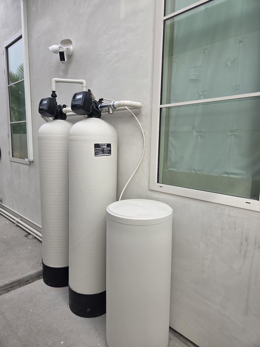 Outdoor dual-tank water softener system with brine tank