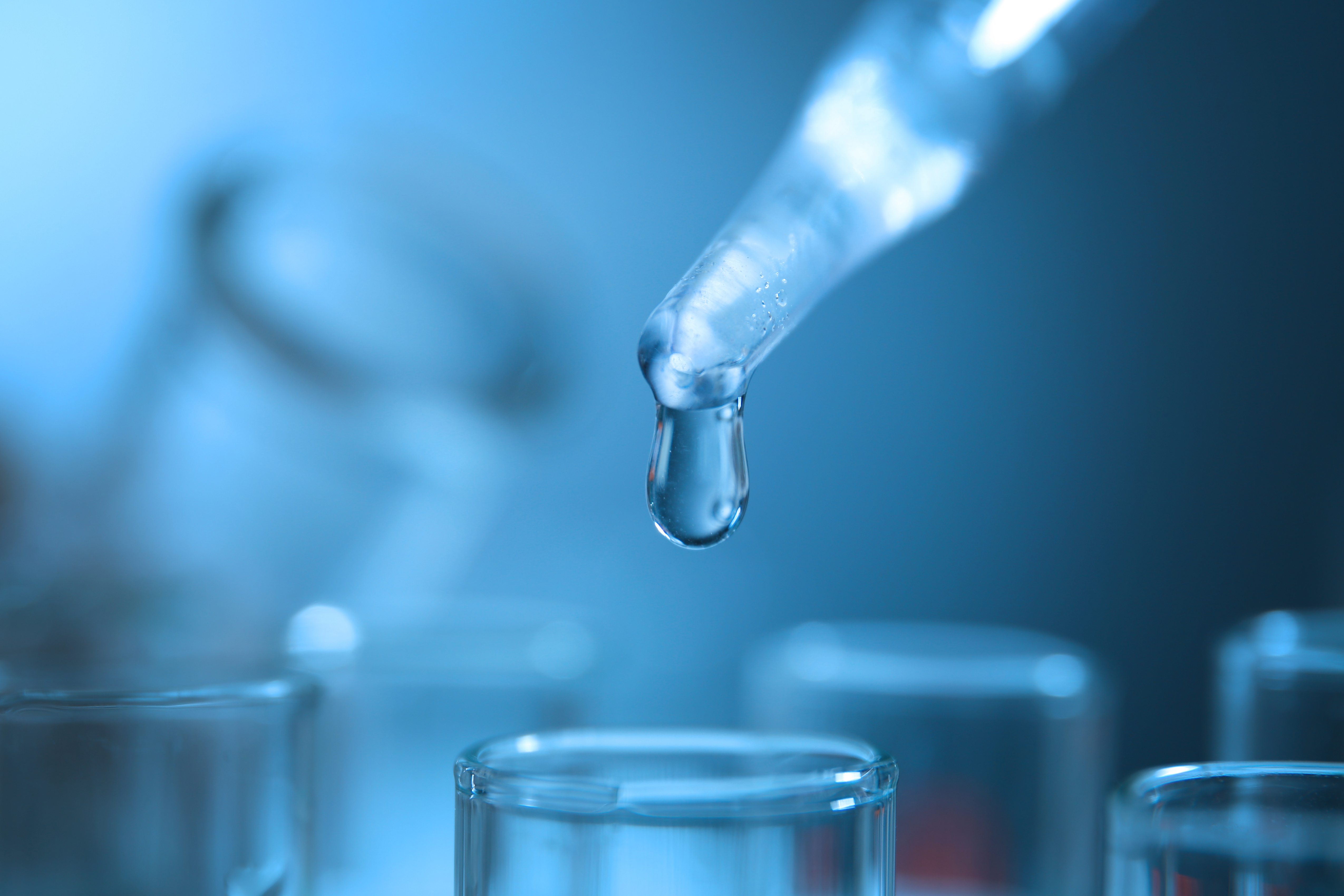 Water testing lab with pipette and beakers